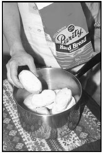 Hard Bread, not widely available in the United States, is rock-like and dry before soaking overnight in water. EPD Photos