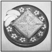 Barros Jarpa (grilled ham and cheese sandwich), served with fruit, is a common lunch for students. EPD Photos
