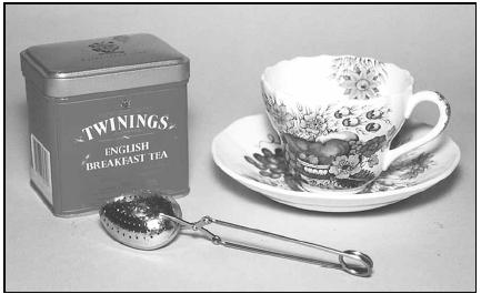 A special spoon designed to hold loose tea may be used when brewing an individual cup of tea. Most people in the UK would brew a full pot of tea at teatime. EPD Photos